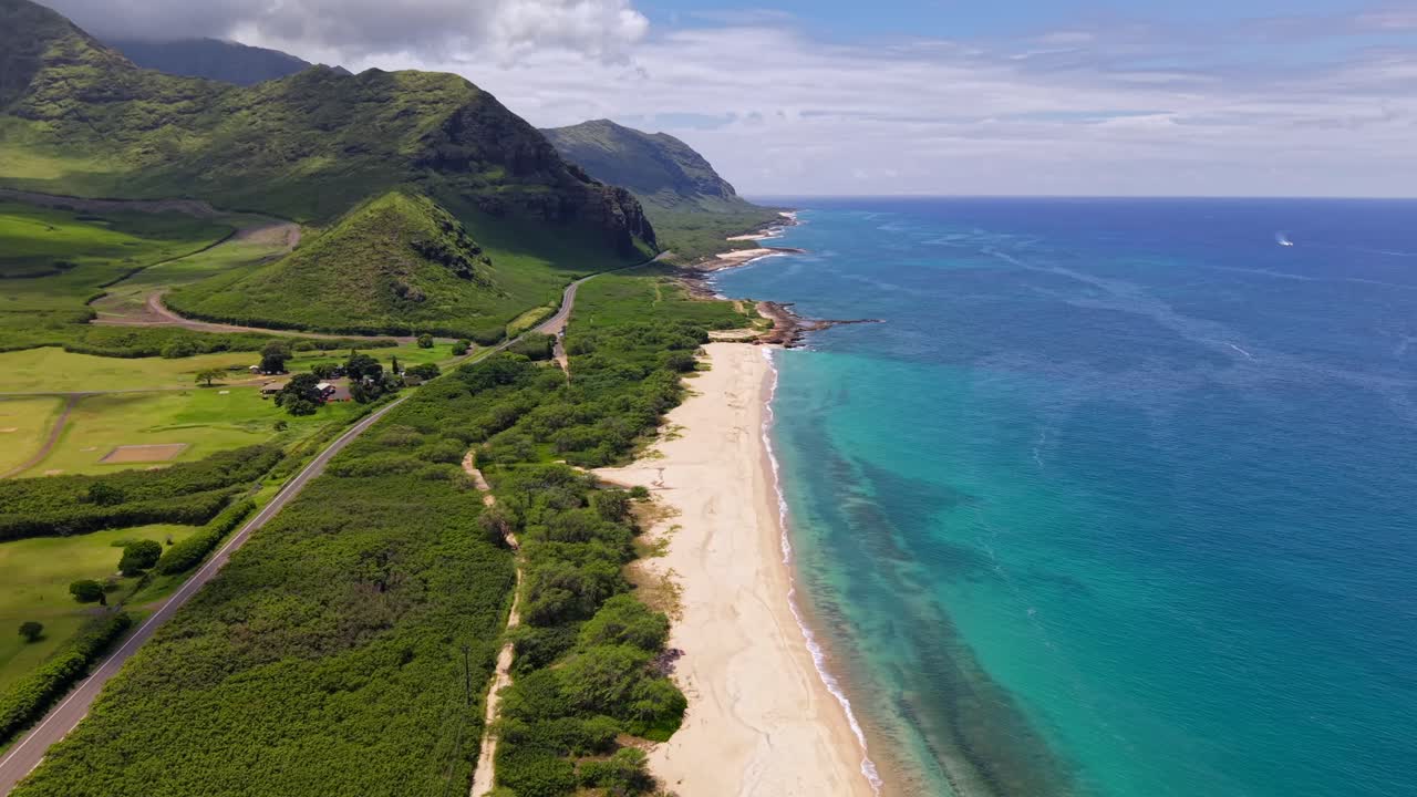 Scenic highway near remote and rugged coastline of Mākua Beach, Oahu Hawaii Aerial