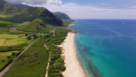 scenic highway near remote and rugged coastline of mākua beach, oahu hawaii aerial