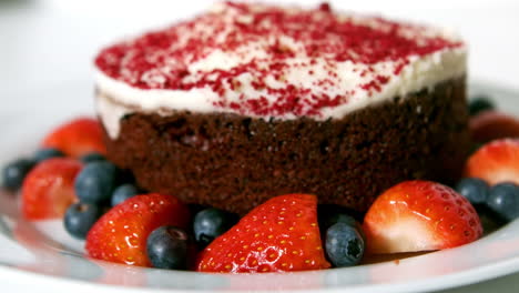 close up view of chocolate cake with red berries