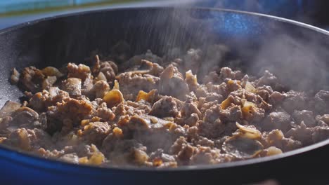 cooking ground turkey quesadilla filling with mushroom and parsley