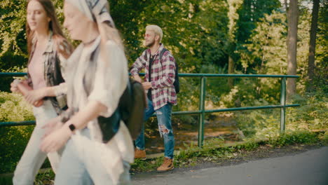 group of tourists spending vacation in forest