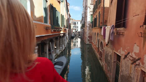 Dolly-forward-of-beautiful-rustic-alley-with-water-canal-and-medieval-houses-in-Venice,Italy