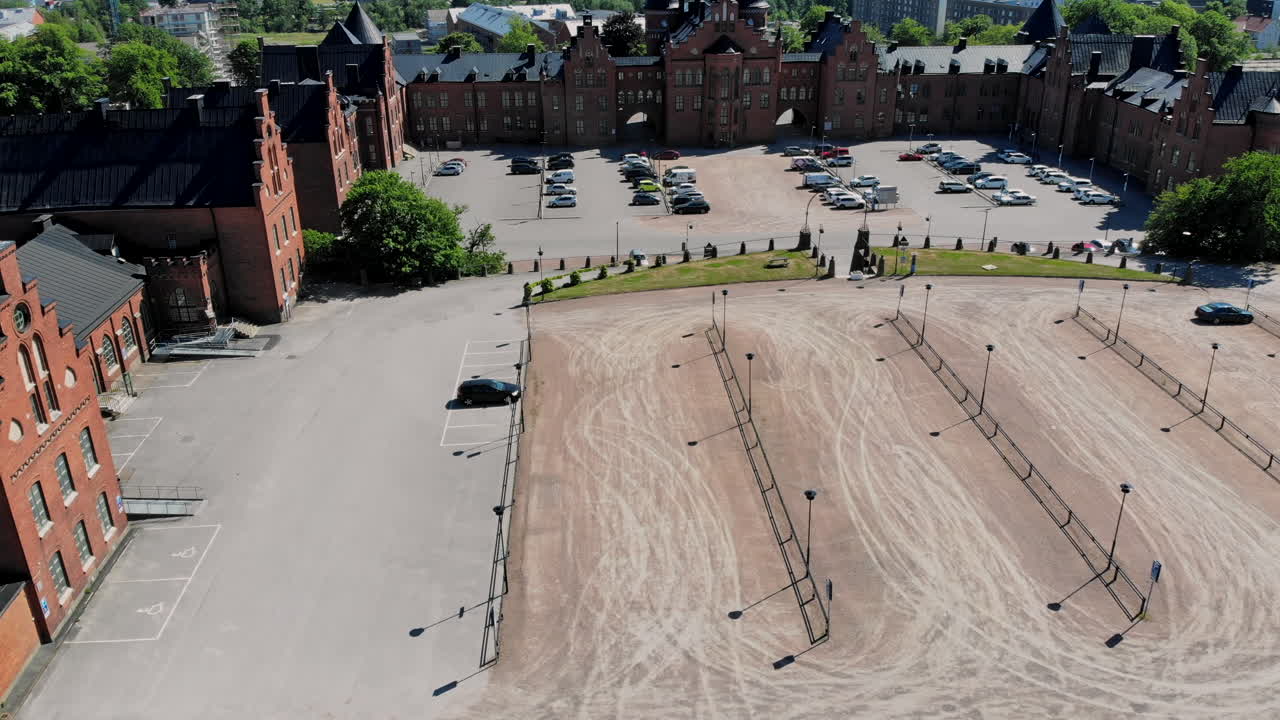 Aerial dolly forward over Kviberg barracks on sunny day