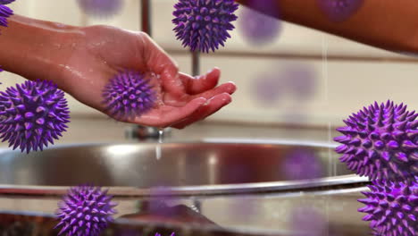 animación de células de macro coronavirus covid-19 que se extienden sobre una mujer lavándose y secándose las manos
