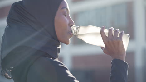 Moslem-woman,-drinking-water