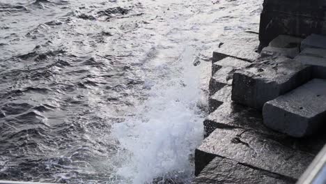 water splashing the rocks at ogden point breakwater