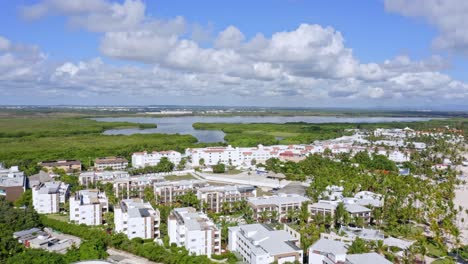 Aerial-view-of-Radisson-Blu-Punta-Cana-on-Caribbean-coast,-and-Laguna-Bavaro