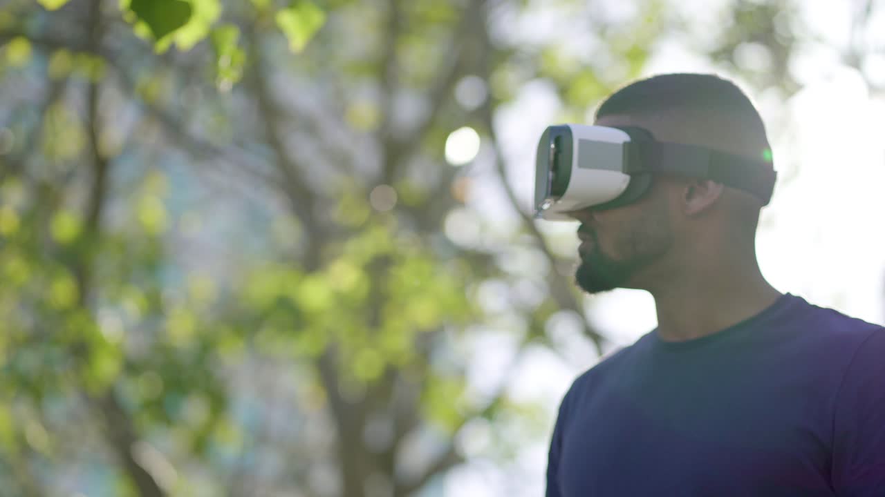 Man in virtual reality glasses managing new reality with hands