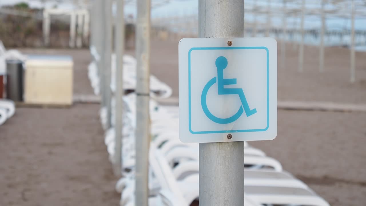 Wheelchair Accessibility Sign on an Empty Beach