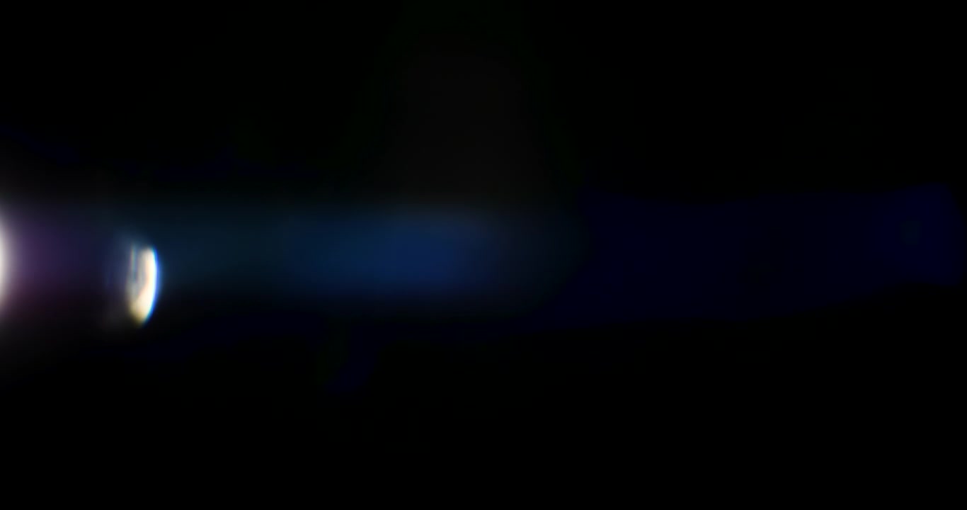 Beautiful, stunning light reflections and anamorphic blue streaks shot on black with high-end cinema anamorphic lens as a background, light leak overlays or transitions for editors