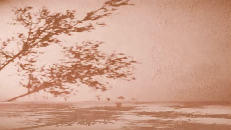 tree branches shadow on textured orange wall. nature silhouette concept