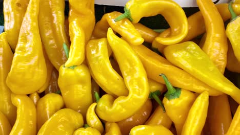 pile of bright yellow peppers