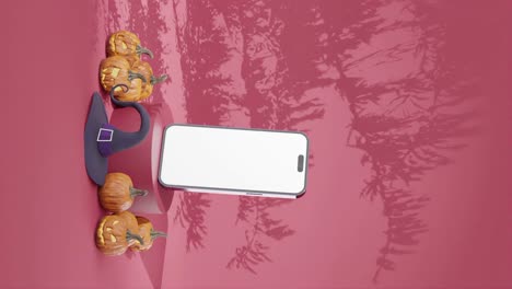 Leere-Smartphone-Mockup-Vorlage-Mit-Rosa-Hintergrund-Und-Halloween-Dekoration