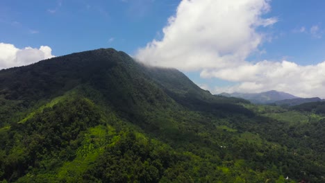 mountain slopes with rainforest and agricultural land of farmers. sri lanka.