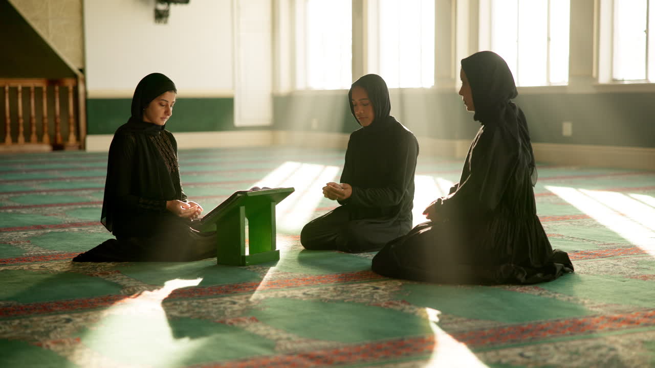 Muslim women praying in a mosque