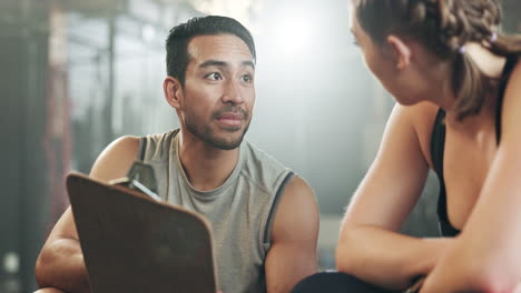 man, woman and clipboard with talking in gym