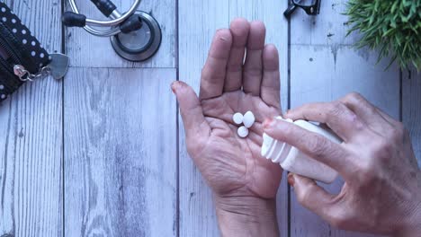 elderly person taking medication