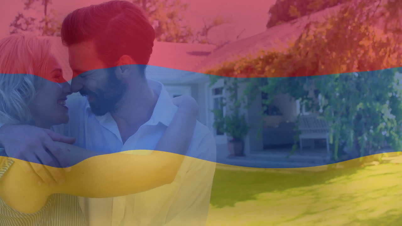 Fuori casa, coppia che si abbraccia con un'animazione di bandiera colorata in sovrapposizione