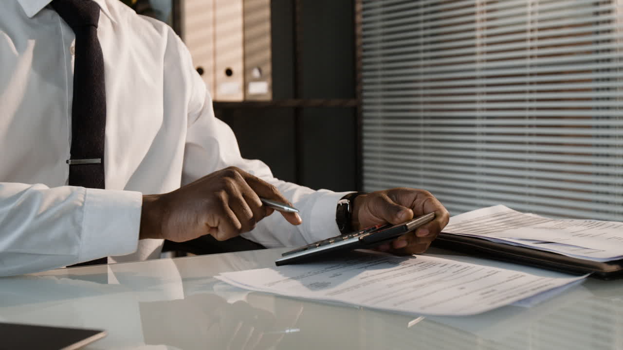 Businessman Calculating Finances