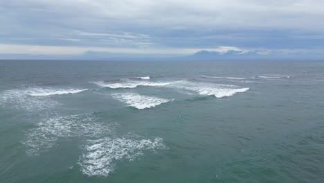 small rippling waves out at sea off the coast of uluwatu, bali