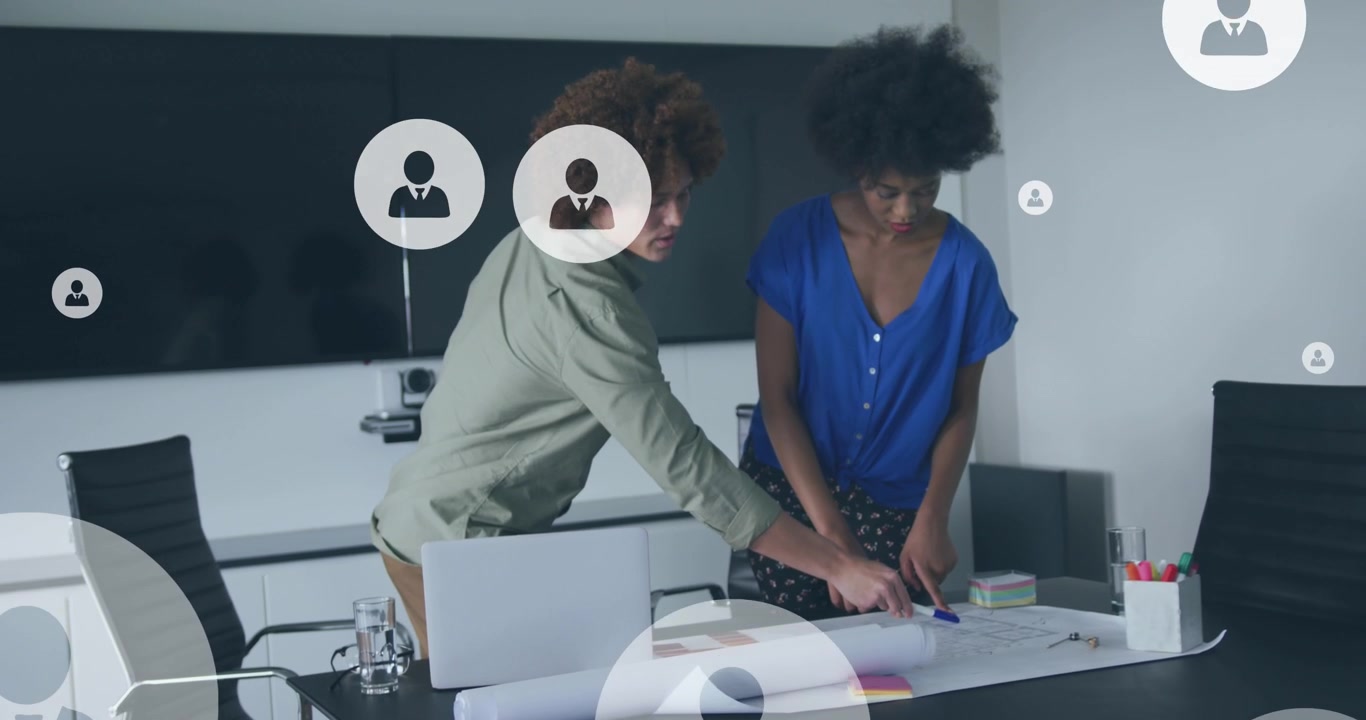 Animation of digital icons over diverse business people in office