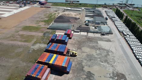 containers stacked london thamesport river medway kent uk drone aerial view