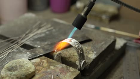 jeweler at work in jewelry. desktop for craft jewelry making with professional tools. close up view of tools. thailand.