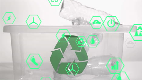 animation of network of eco and environmentally friendly icons over plastic bottles