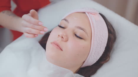 woman receiving facial treatment