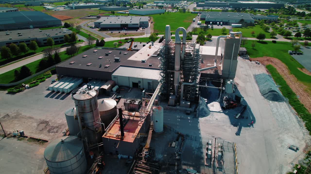 Aerial view of large-scale manufacturing plant with silos and processing towers near De Perre Wisconsin, USA