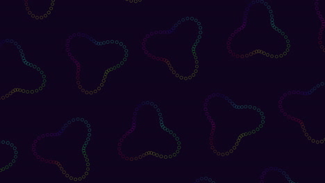 an abstract image displaying a circular pattern of overlapping and spaced-out dots on a black background. the dots show various shades of purple and pink hues