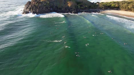 cabarita beach with surfers in summer in new south wales, australia - aerial drone shot