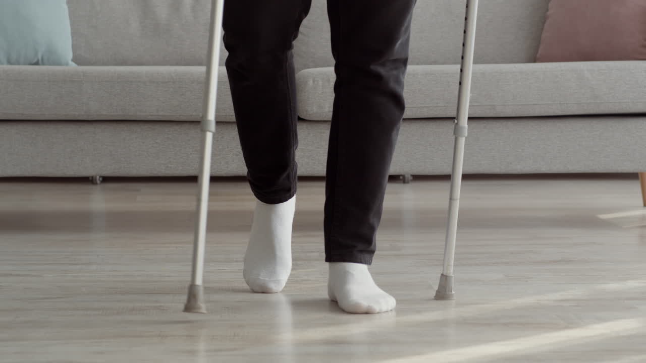 Person Walking with Crutches