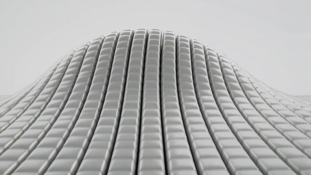 Procedural tiled grid starting on play, central columns rising, deforming into dome for design