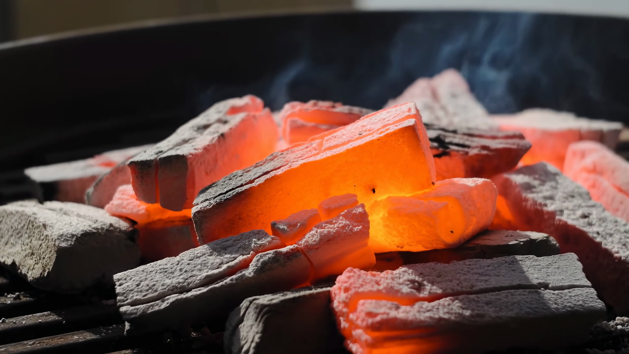 Glowing Charcoal On Grill Grate, Closeup Showing Redhot Briquettes Dusted With White Ash And Wisps Of Smoke,