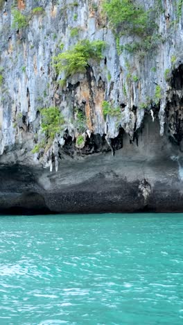 turquoise waters and lush cliffs in krabi