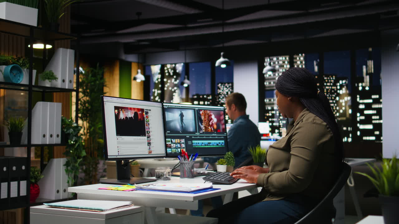 Woman video creator working on editing a movie montage project