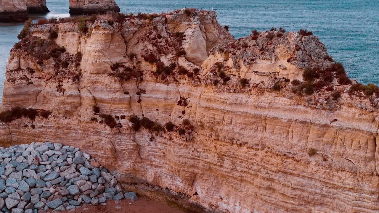 Coastline rocks at sunset near Lagos in Portugal