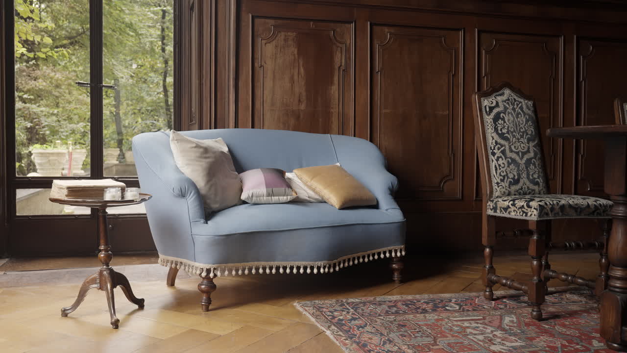 Elegant Antique Living Room with Blue Sofa