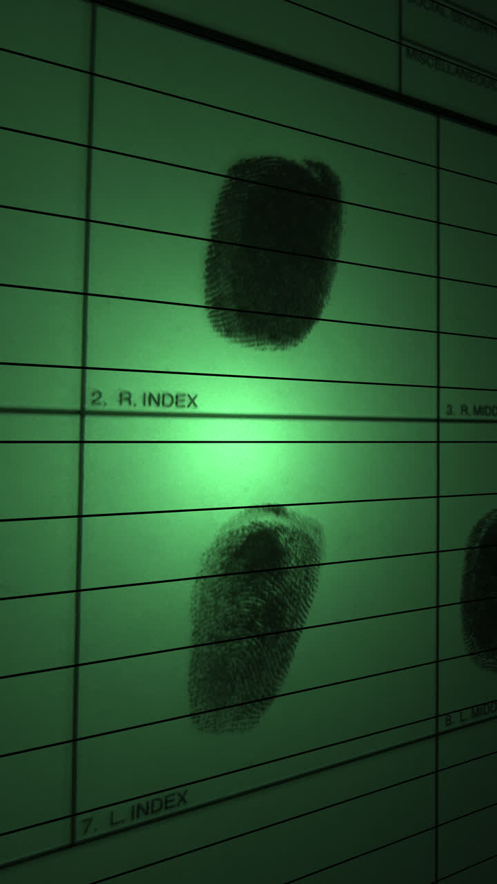 Green spotlight scans over multi fingerprint identification files