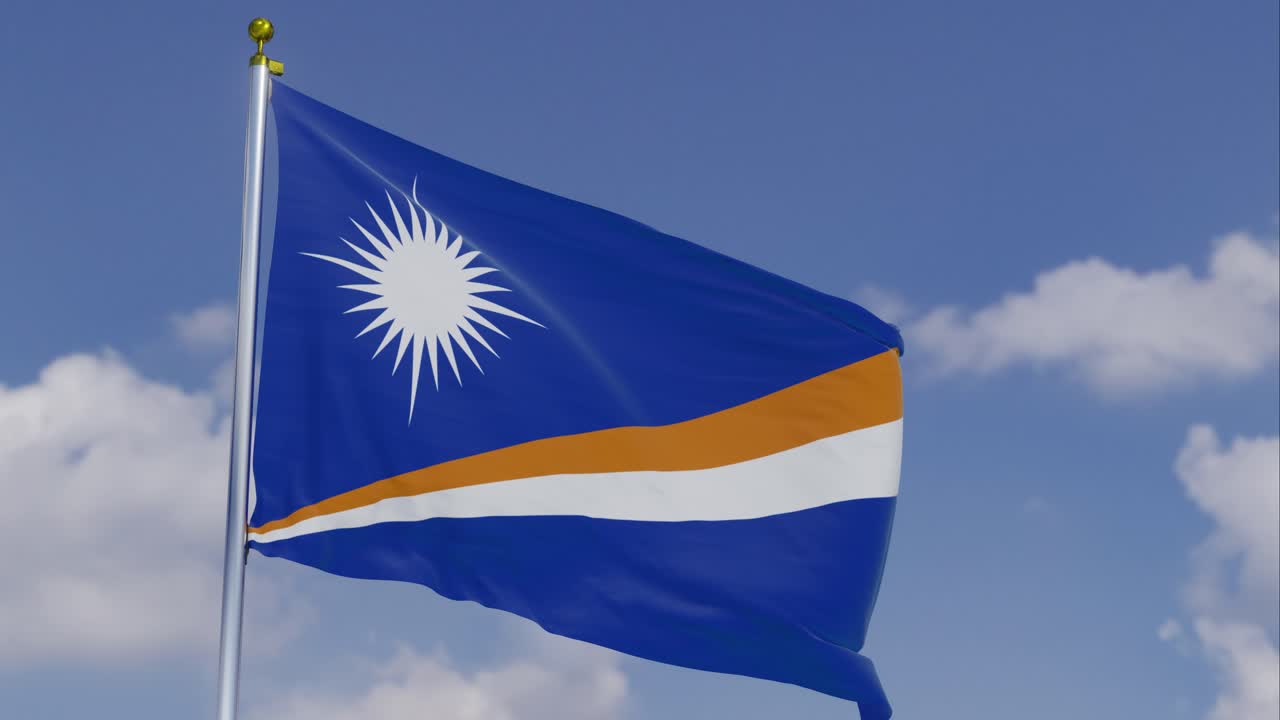 Flag Of The Marshall Islands Moving In The Wind With A Clear Blue Sky In The Background, Clouds Slowly Moving, Flagpole, Slow Motion