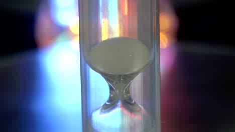 a small hourglass dropping the sand