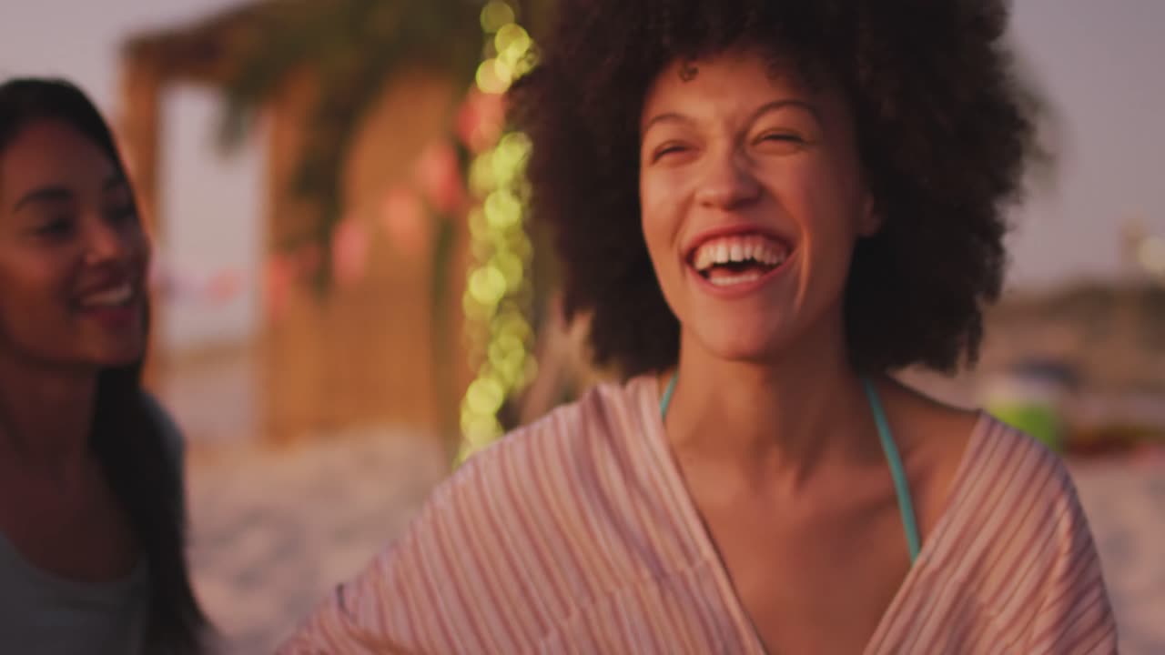 Mixed race woman enjoying on the beach