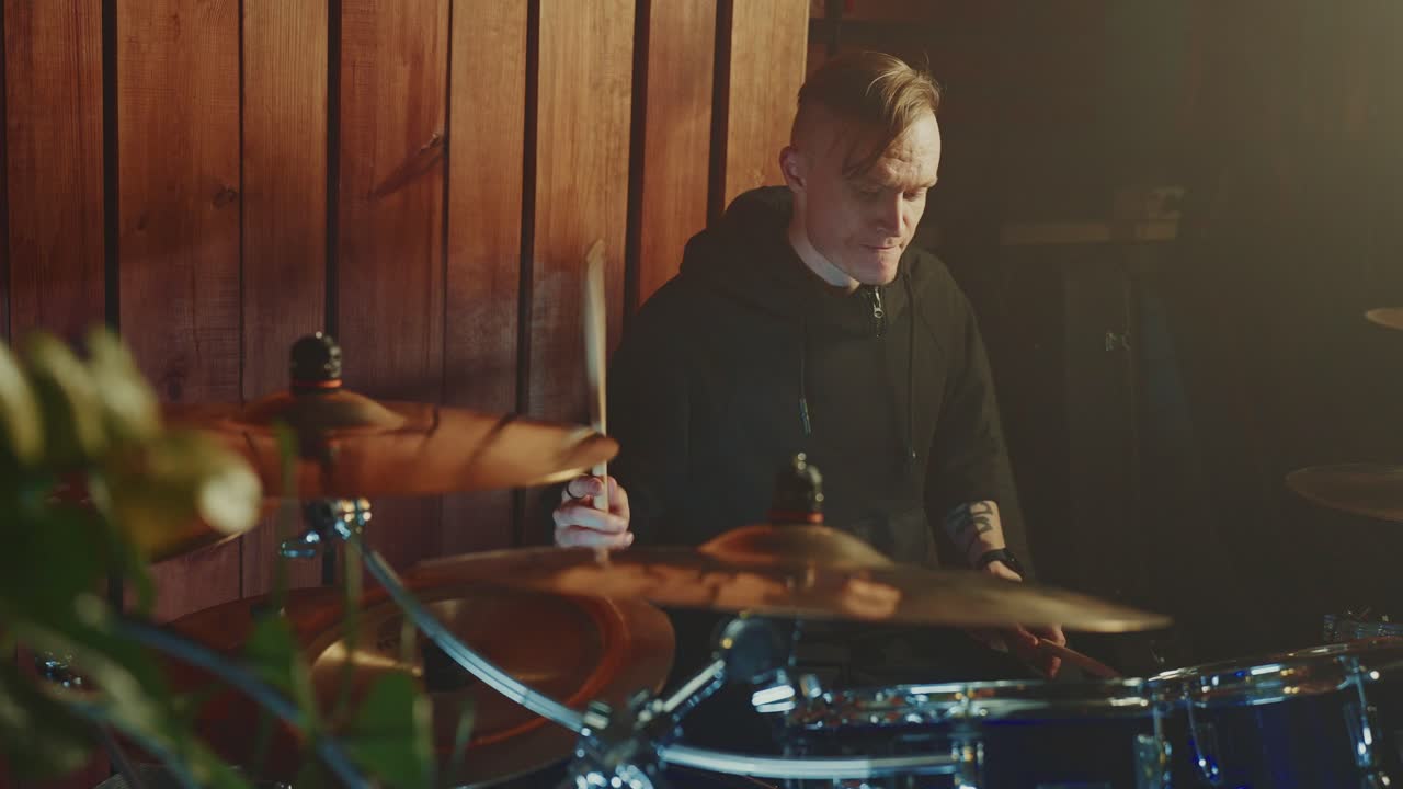 Drummer Playing Drums in a Studio