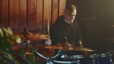 drummer playing drums in a studio