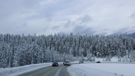 Scenic-Snowy-Windy-Road-in-Banff,-Alberta-4K