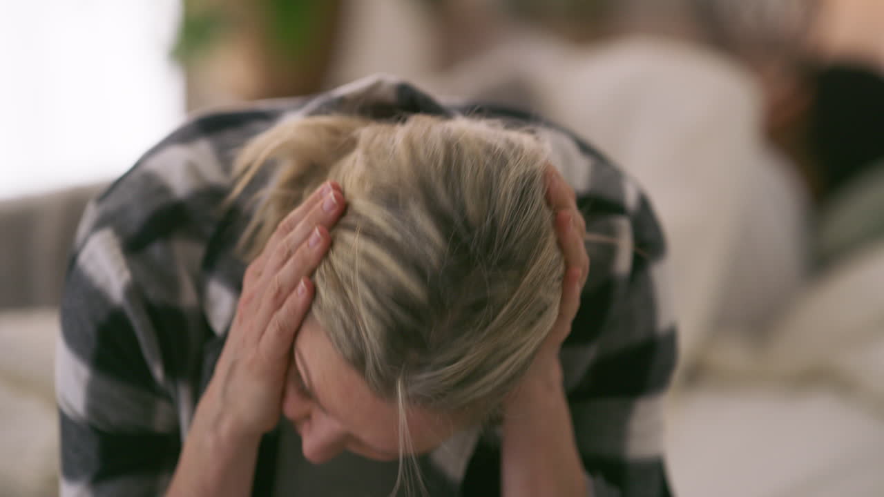 A woman experiencing sadness and anxiety