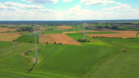 aerial view of powerful wind turbine farm for energy production on beautiful cloudy sky at highland