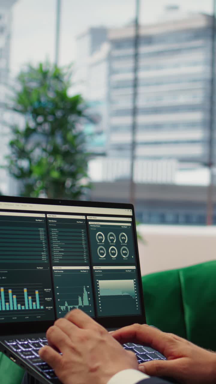 Vertical Video Determined CEO works in office analyzing infographics and setting business goals