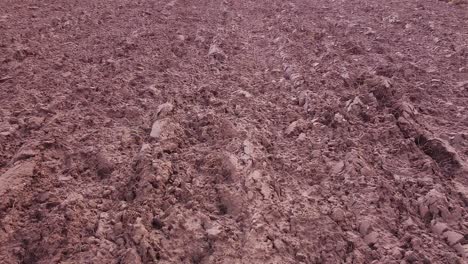 Freshly-plowed-soil-field-for-cereals-from-above-aerial-view